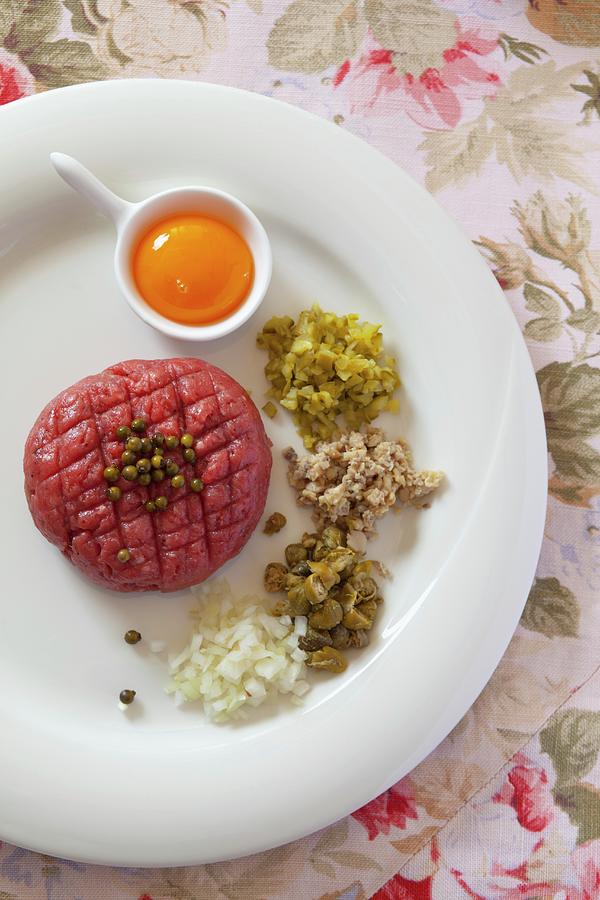 Steak Tartare With Egg Yolk, Capers, Onions, Mushrooms, Pickled Vegetables And Green Peppercorns Photograph by Studio Lipov