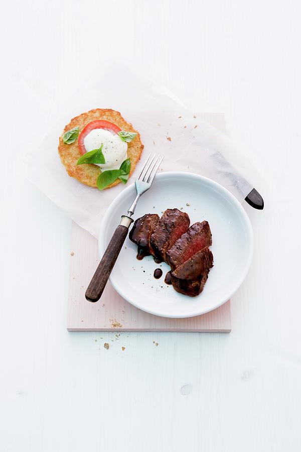 Steak With Balsamic Cream And Potato Cakes Photograph by Michael Wissing