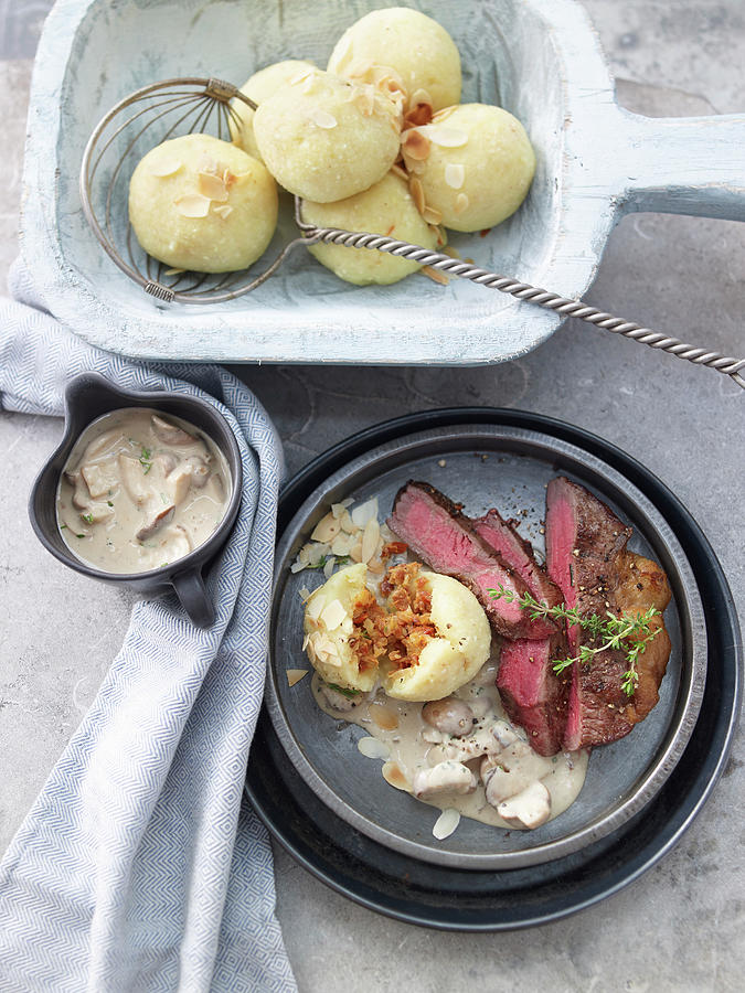 Steaks With Almond Potato Dumplings And Creamy Mushroom Sauce Photograph by Jan-peter Westermann / Stockfood Studios