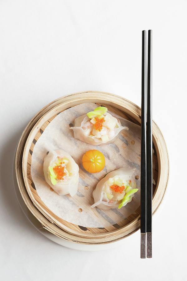 Steamed Chinese Dumplings With Prawns And Fish Roe In Bamboo Steaming Basket With Chopsticks Photograph by Sarah Coghill