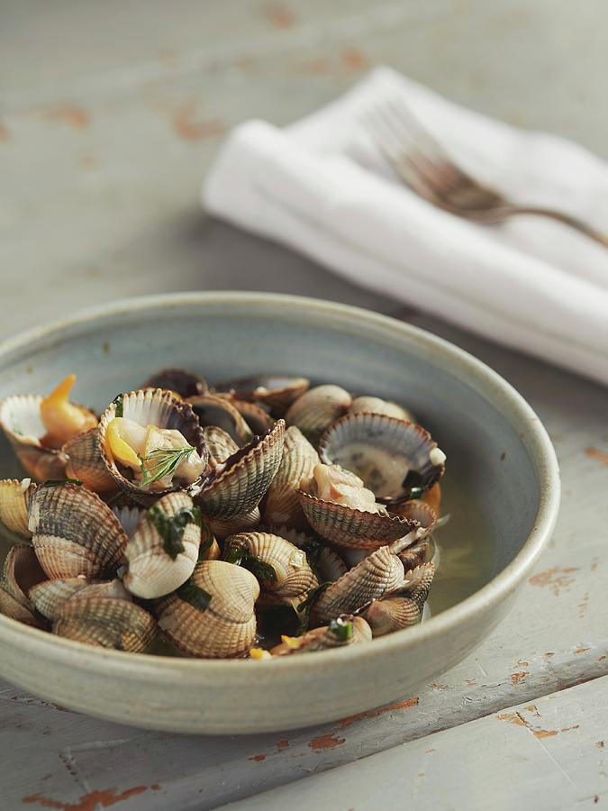 Steamed Cockles In Bowl Photograph by Lukejalbert