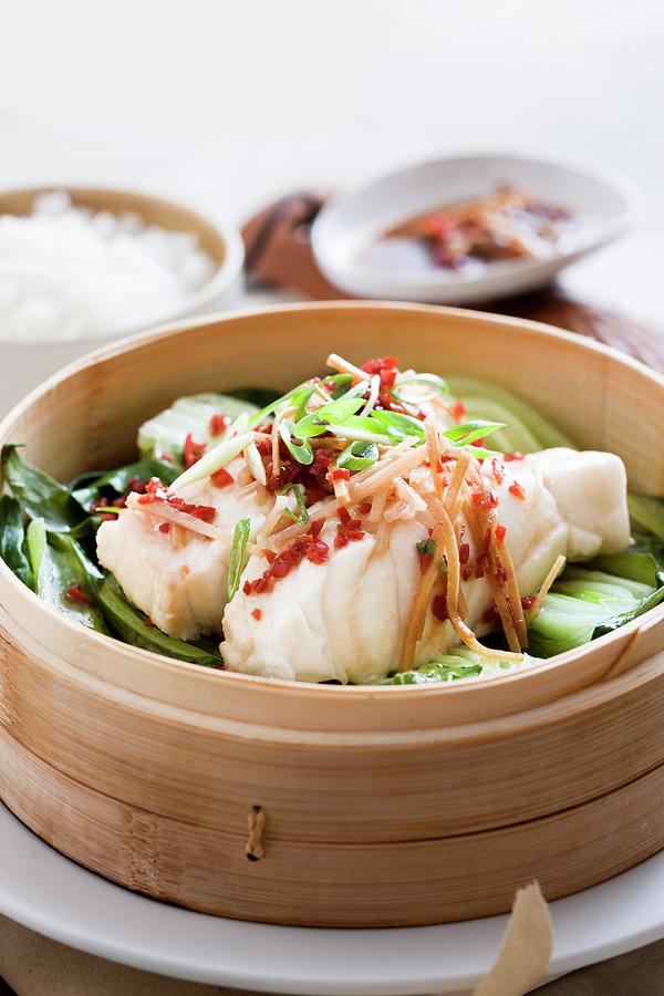 Steamed Fish On A Bed Of Bok Choy With Ginger And Chilli Photograph by Andrew Young