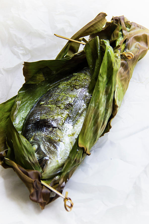 Steamed Gilt-head Bream In A Banana Leaf With Pesto Photograph by Charlotte Von Elm