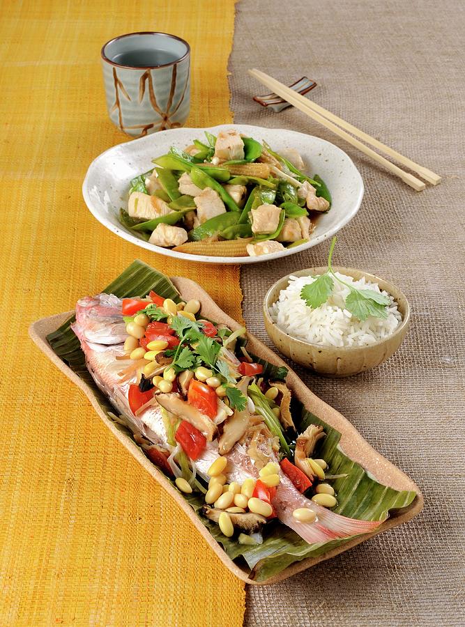Steamed Pandora In A Banana Leaf, And Stir-fried Chicken With Vegetables Photograph by Franco Pizzochero