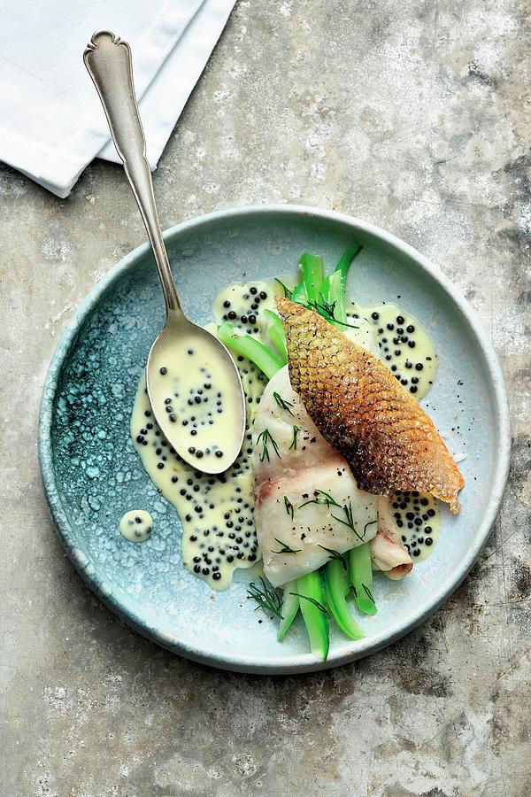 Steamed Sea Bass With Cucumber And Caviar Nage Photograph by Jalag / Mathias Neubauer