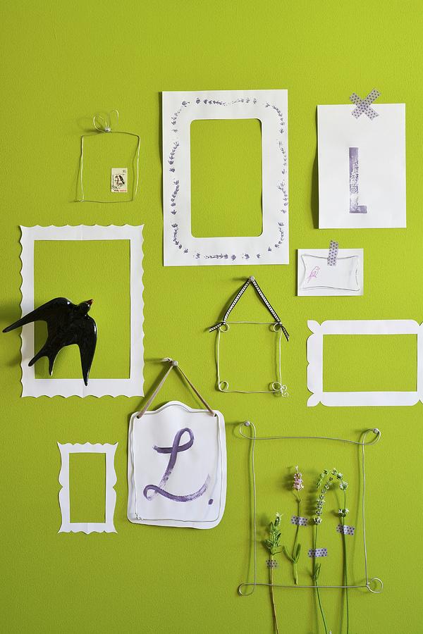 Stems Of Lavender In Wire And Paper Picture Frames On Green Wall Photograph by Studio27neun