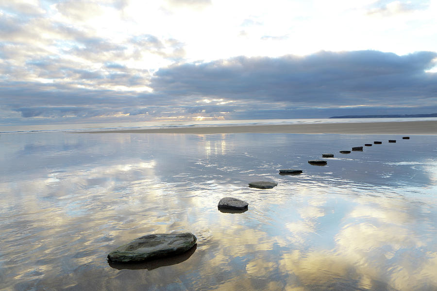 Stepping Stones Over Water With Sky Photograph by Peter Cade