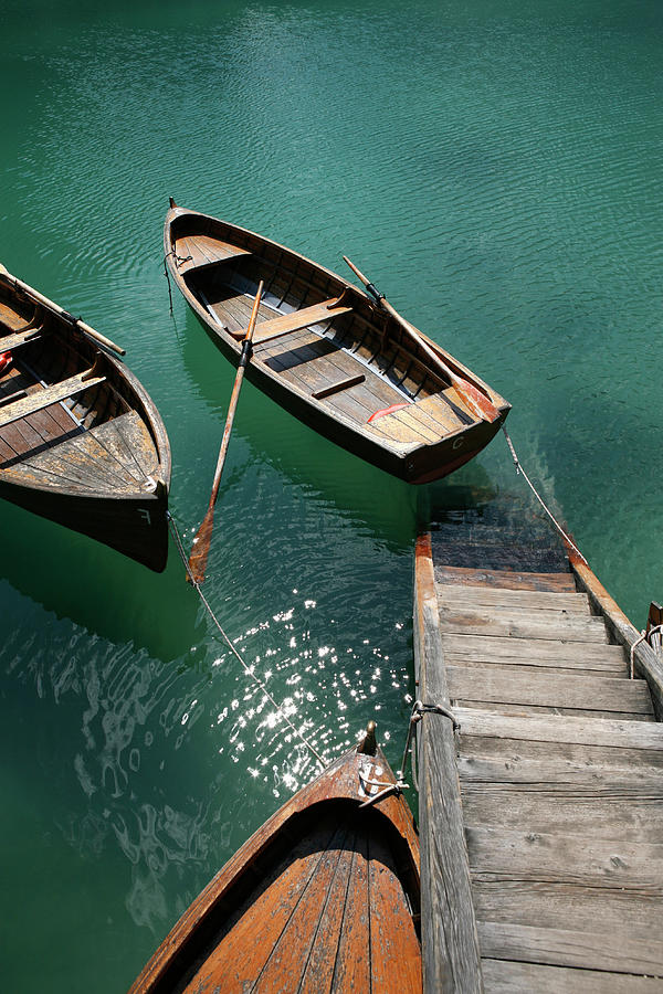 Steps Down To Wooden Boats Floating On Photograph by Marc Volk