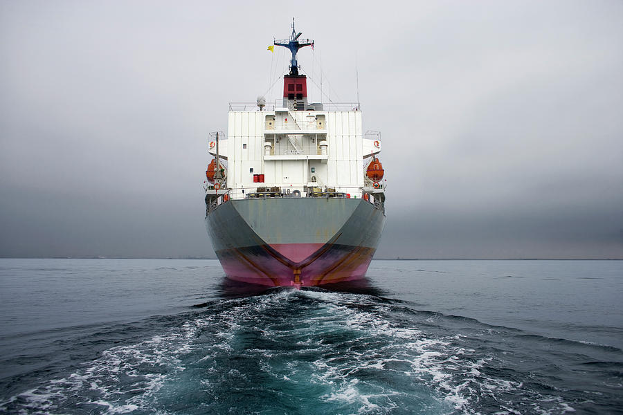 Stern Of A Grey And Pink Cargo Ship Photograph by Stewart Sutton