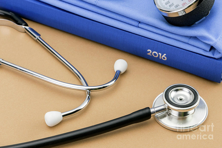 Stethoscope Next To A Book Photograph by Digicomphoto/science Photo Library