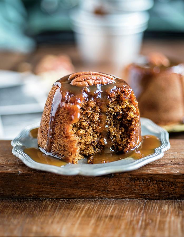 Sticky Toffee Pudding With Dates, Ginger And A Brandy Toffee Sauce Photograph by Lucy Parissi