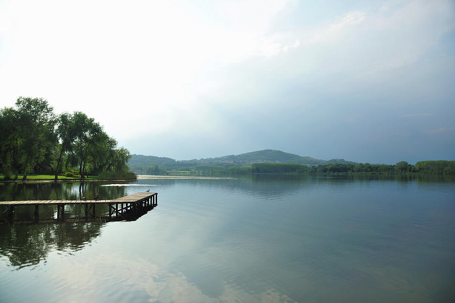 Still Lake Under Blue Sky Photograph by Daniela Buoncristiani Still Lake Under Blue Sky Photograph by Daniela Buoncristiani