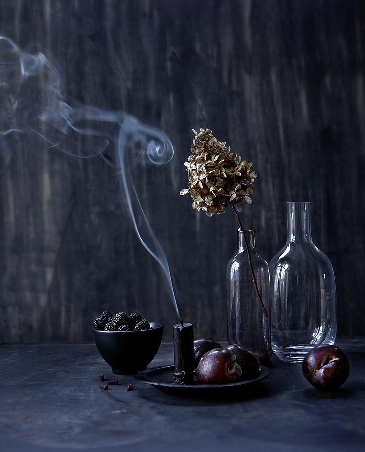 Still-life Arrangement With Smoking Candle, Autumn Fruits And Dried Flowers In Vase Photograph by Klaudia Iga Studio