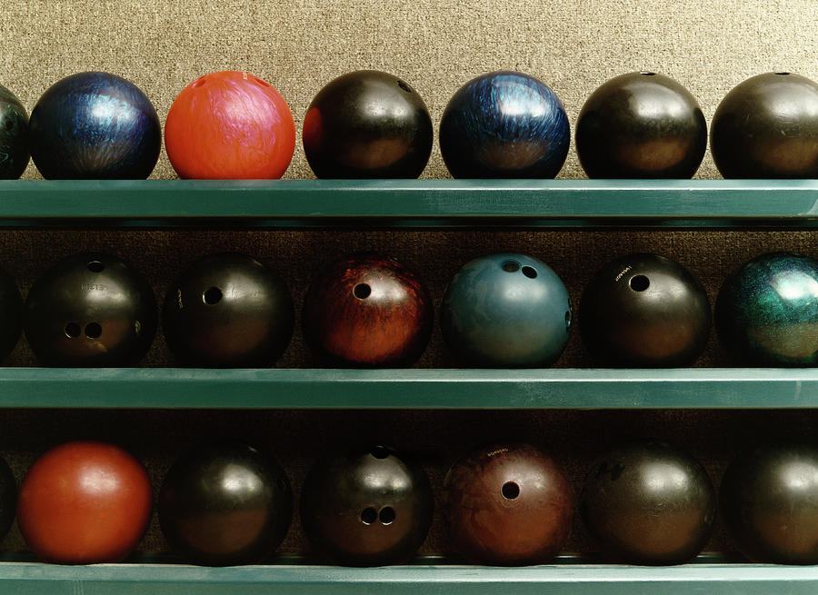 Still Life Of Bowling Balls On A Shelf Photograph by Terry Vine