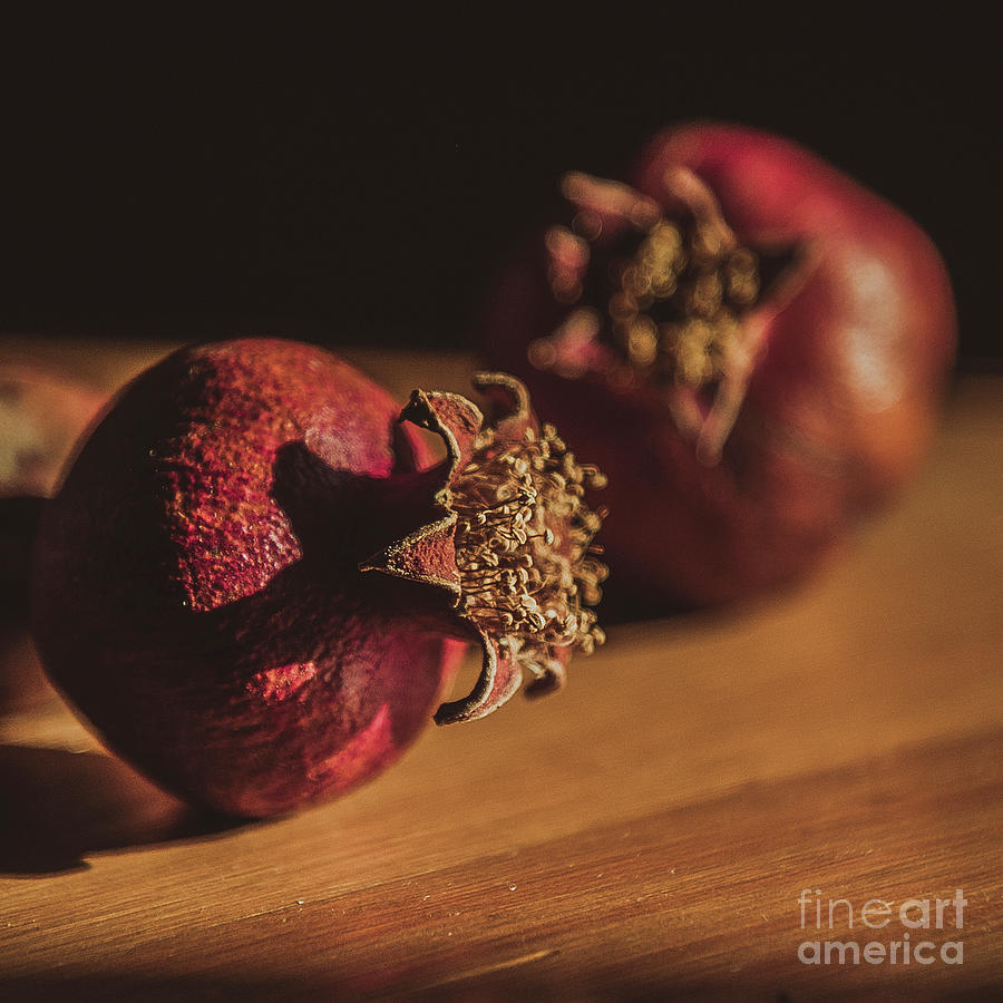 Still Life With Couple Of Dry Pomegranates On The Wooden Table, Photograph
