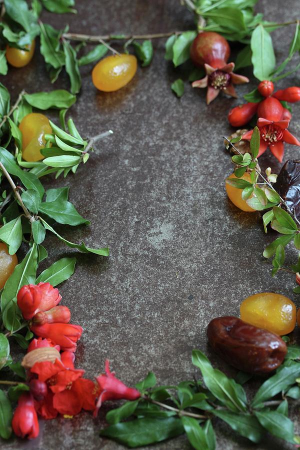 Still Life With Dates, Candied Fruit And Pomegranate Branches Photograph by Milly Kay