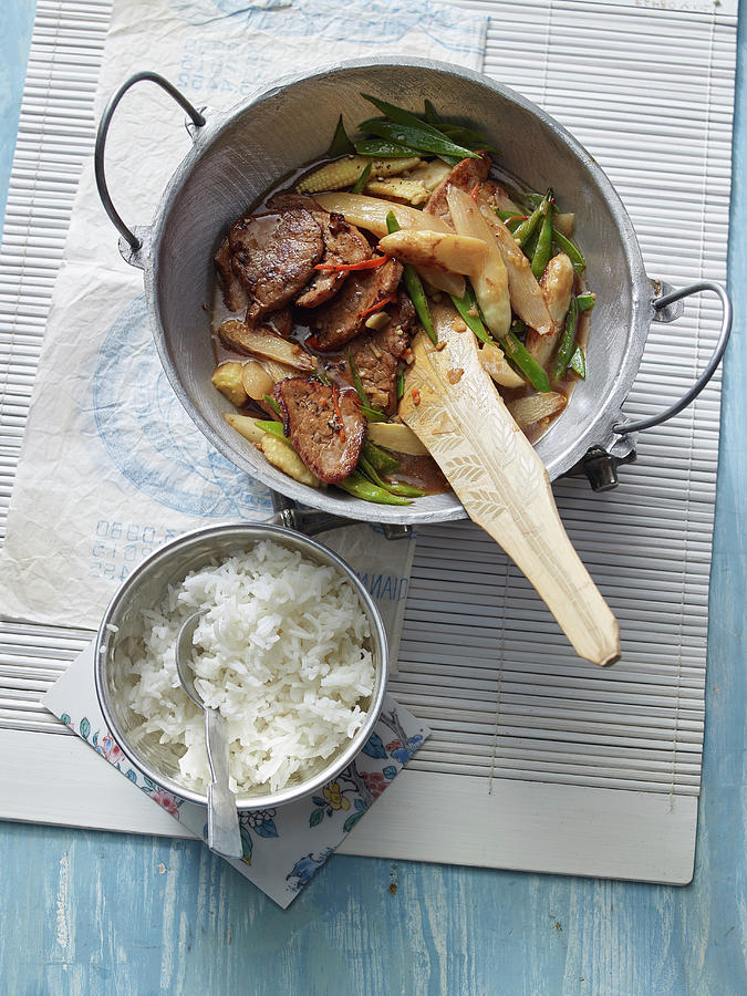 Stir Fried Asparagus With Pork Fillets And Basmati Rice Photograph by Jan-peter Westermann