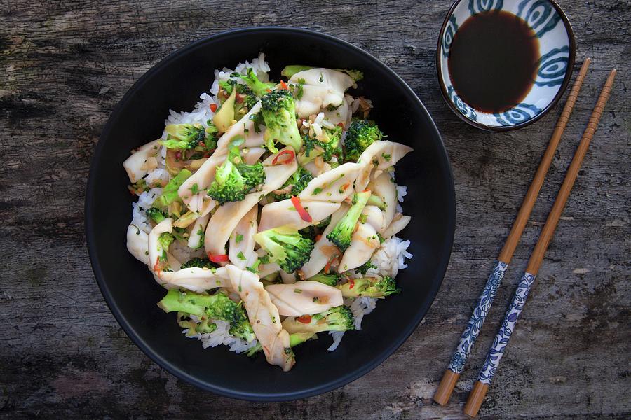 Stir Fried Squid With Broccoli And Chilli On A Bed Of Rice Photograph by Andr Ainsworth