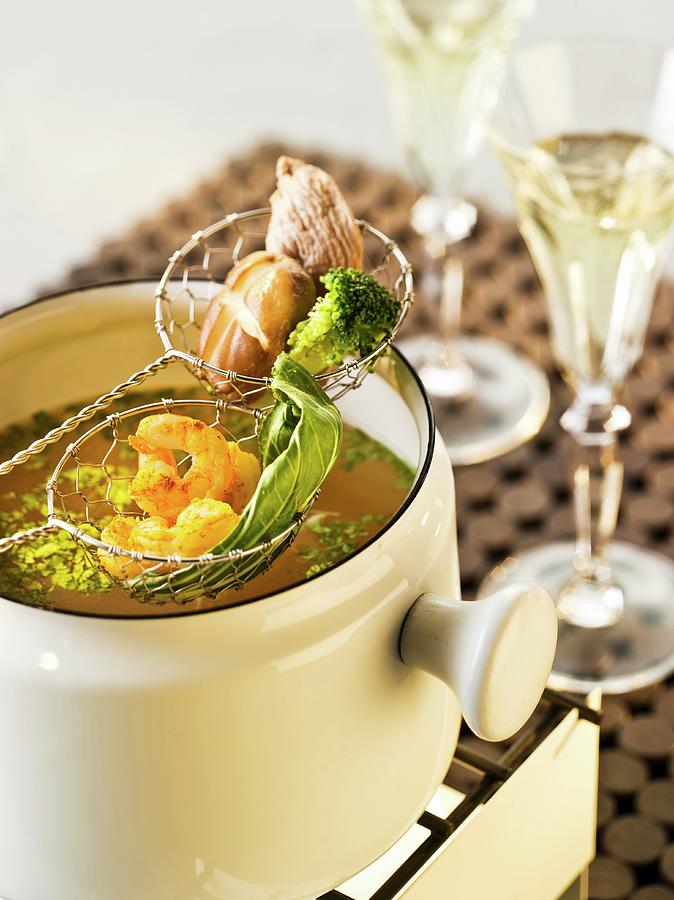 Stock Fondue With Prawns And Vegetables Photograph by Manfred Jahrei
