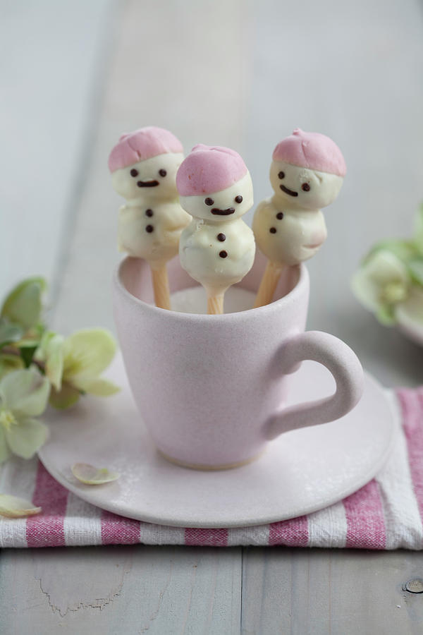 Stollen Cake Pop Snowmen Covered In White Chocolate And Presented In A Cup Of Sugar Photograph by Martina Schindler