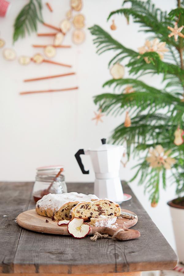 Stollen Fruit Cake, Jar Of Honey And Espresso Pot On Wooden Table Next To Small Christmas Tree With Straw Stars Photograph by Syl Loves
