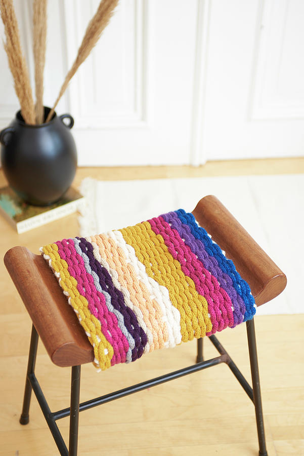 Stool With Cover Made From Knitted Tubes Made Using Knitting Dolly Photograph by Hsfoto