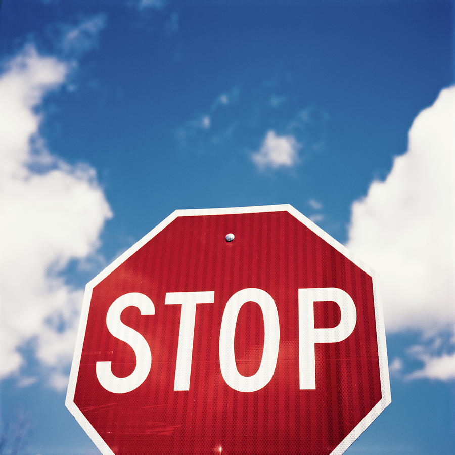Stop Sign Against Blue Sky And Puffy Photograph by Sean Molin - Www.seanmolin.com