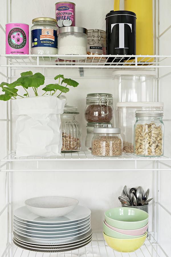 Storage Jars And Crockery On Open Kitchen Shelves Photograph by Cecilia Mller