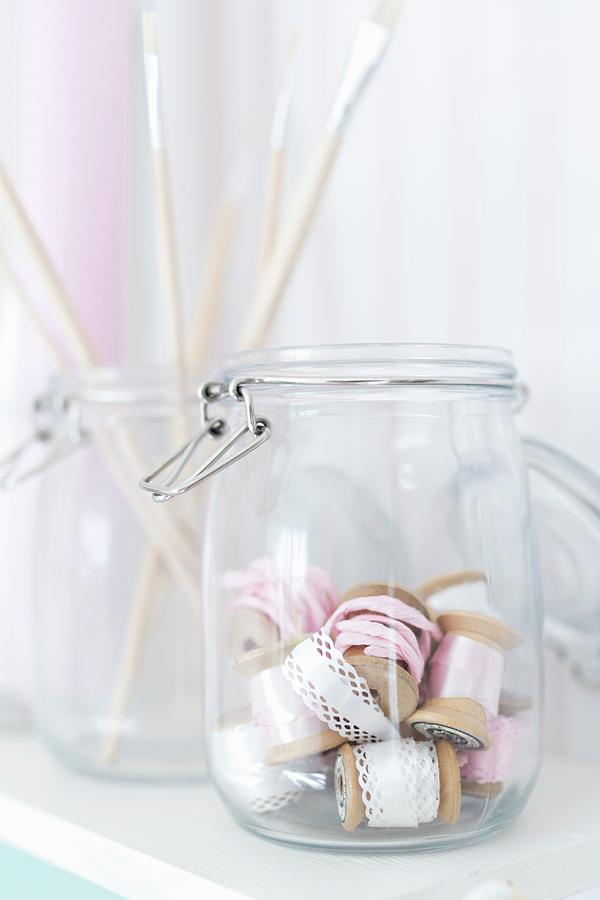 Storage Jars Holding Paintbrushes And Ribbons Photograph by Cecilia Mller