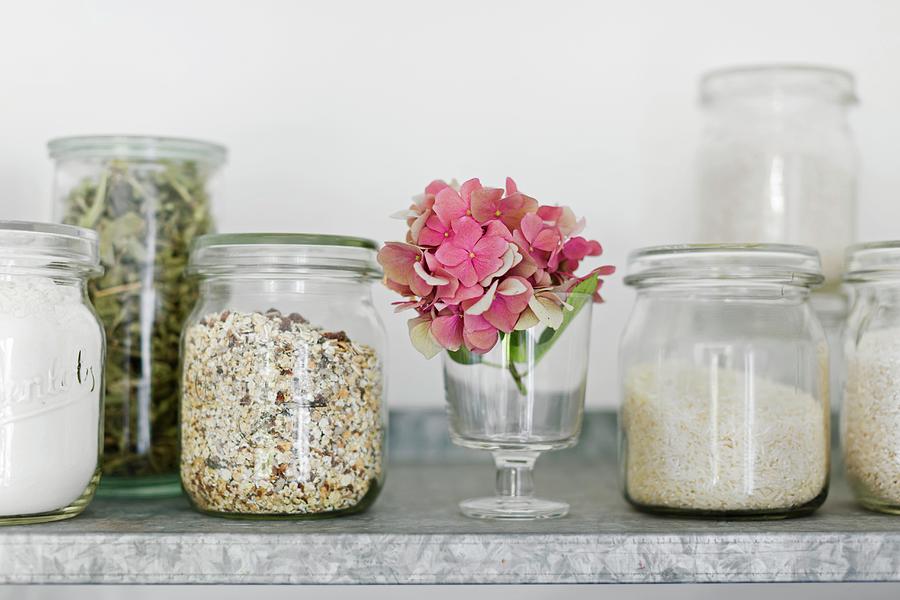 Storage Jars old Preserving Jars With Muesli, Rice, Verbena Leaves And Flour On A Zinc Shelf In The Kitchen Photograph by Sabine Lscher