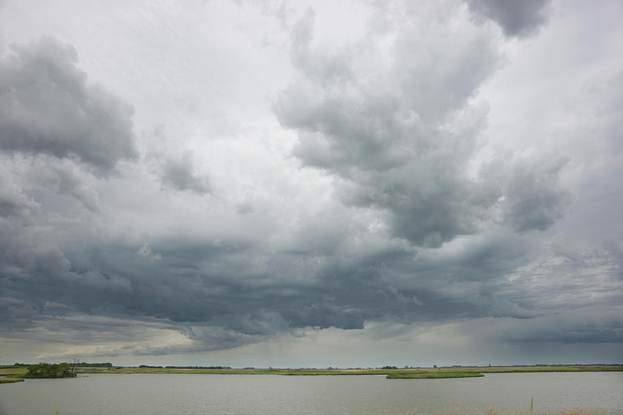 Storm Clouds Over Pond Photograph by Dlerick