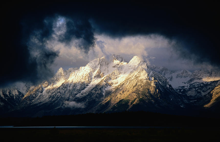 Storm Clouds Over Snow-capped Mountain Photograph by Lonely Planet