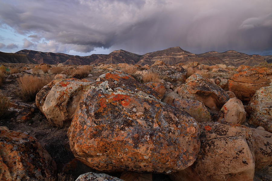 Storm over Book Cliffs and Colorful Boulders Photograph by Ray Mathis