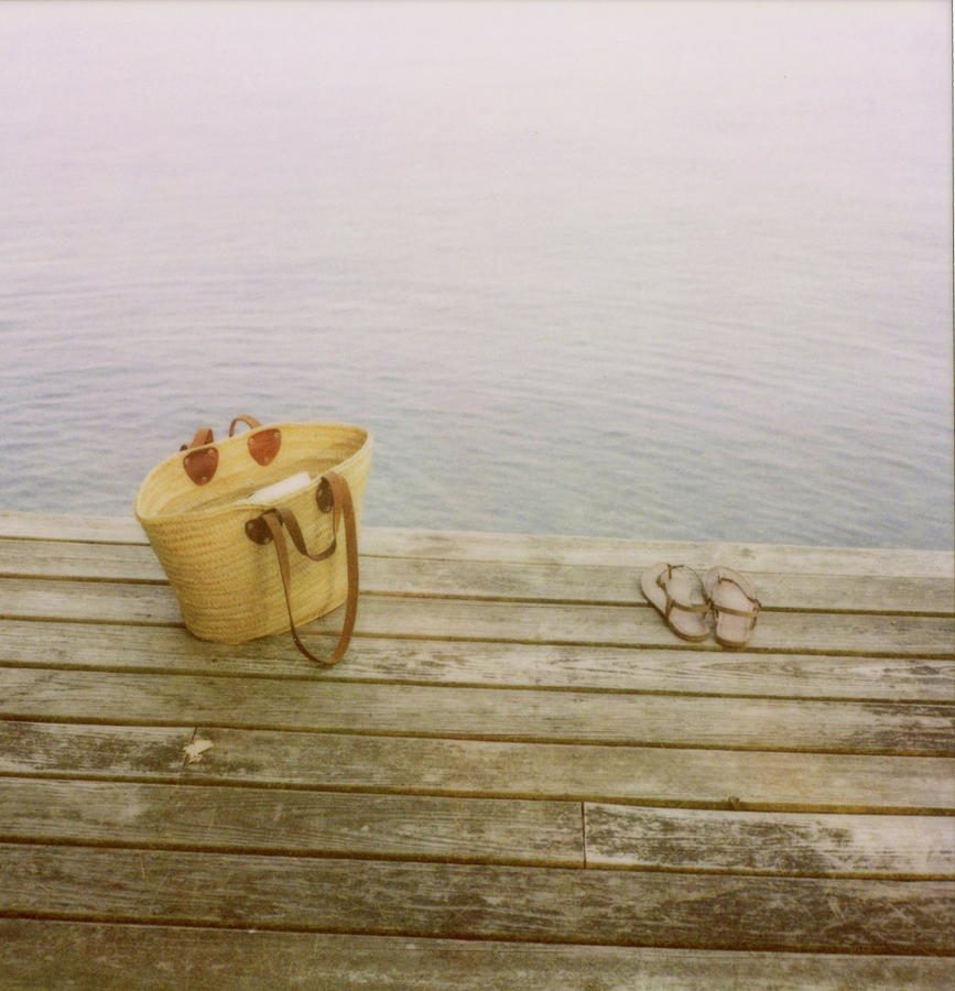 Straw Basket And Sandals On Wooden Lake Photograph by Brooke Schmidt