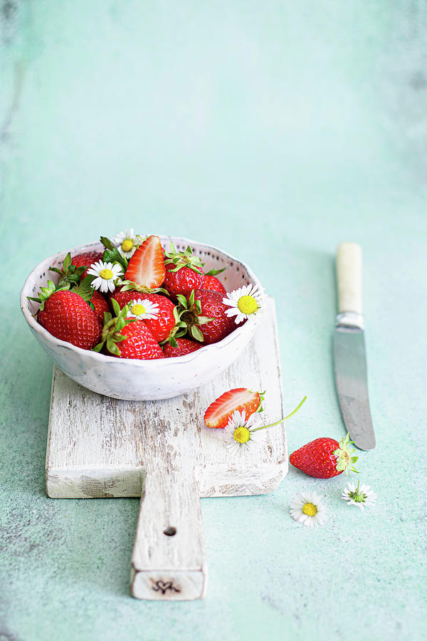 Strawberries In A Bowl With Daisies Flowers Photograph by Karolina Nicpon