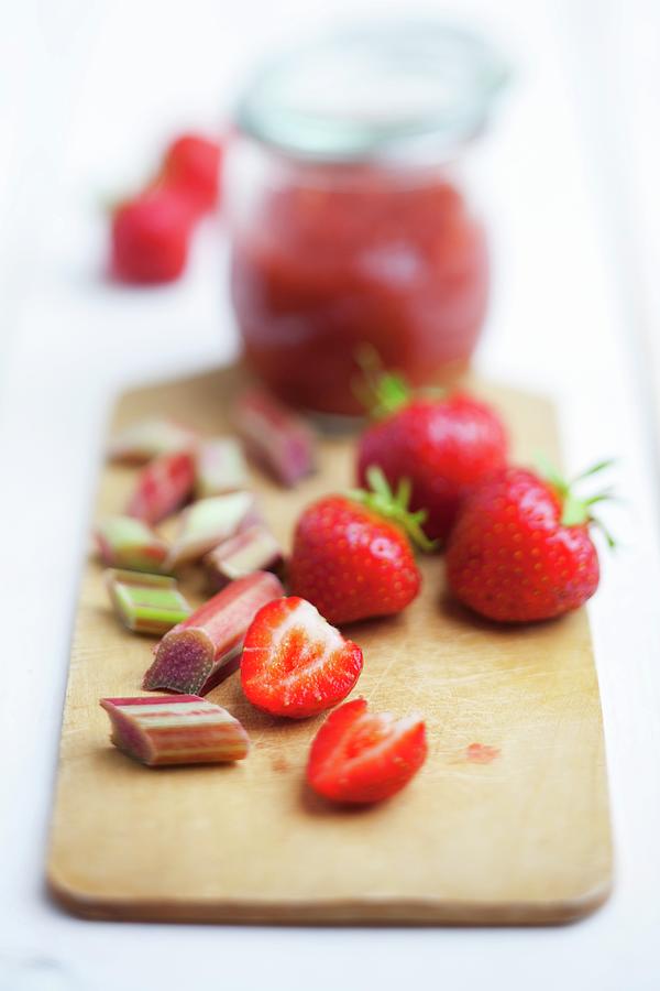 Strawberries, Rhubarb And Strawberry & Rhubarb Jam On A Wooden Board Photograph by Timmann, Claudia