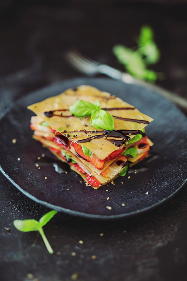 Strawberry And Serrano Ham Lasagne With Filo Pastry And Balsamic Cream Photograph by Jan Wischnewski