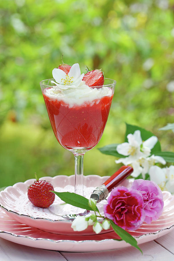 Strawberry Compote In Stemmed Glass And Flowers Photograph by Angelica Linnhoff