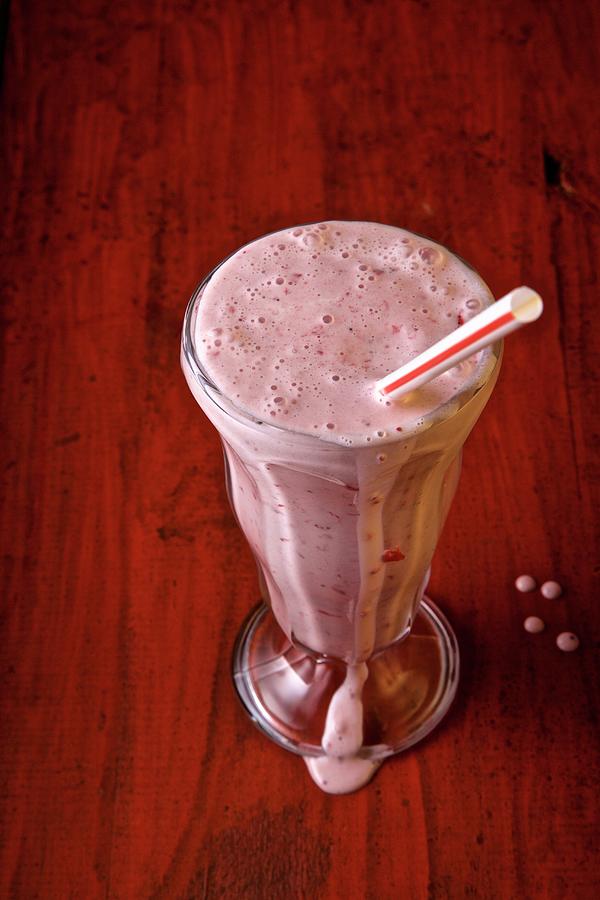 Strawberry Milk Shake On A Red Background Photograph by Andre Baranowski