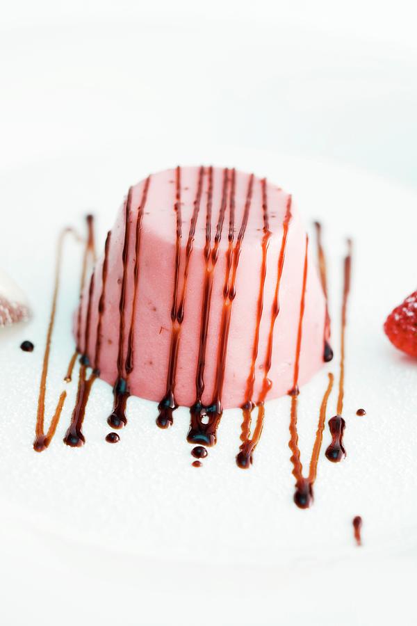 Strawberry Panna Cotta Decorated With Chocolate Sauce Photograph by Michael Wissing