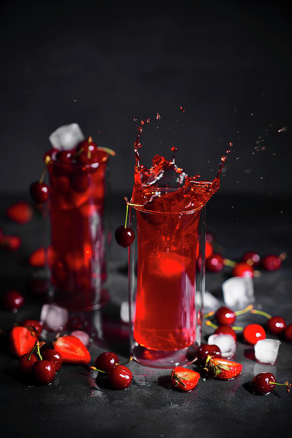Strawberry, Rhubarb And Cherry Drink With Ice Photograph by Karolina Polkowska