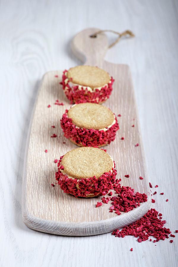 Strawberry Shortcake Ice Cream Sandwiches On A Chopping Board Photograph by Adrian Britton