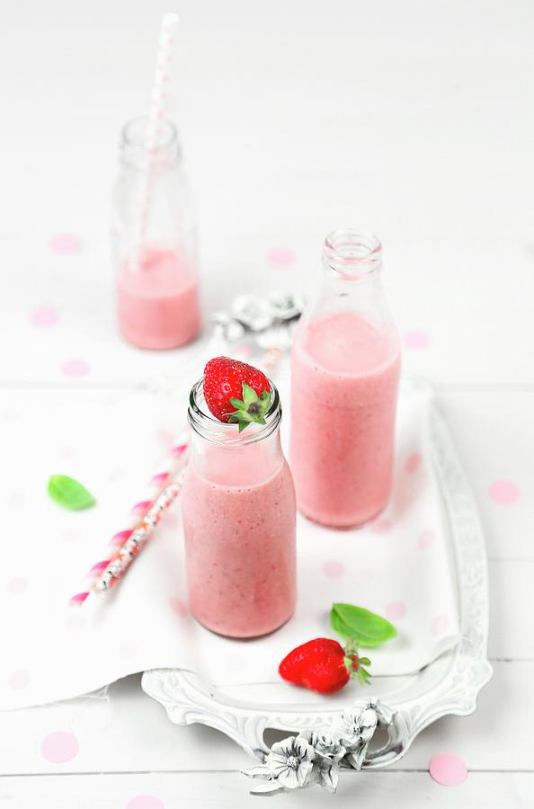 Strawberry Smoothie In Bottles Photograph by Claudia Gargioni