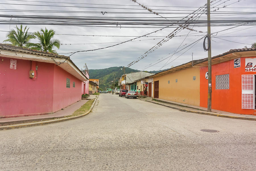 Street and the mountain at the background in El Paraiso, Hondura Photograph by Marek Poplawski