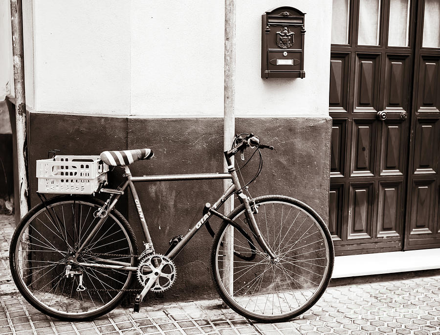 Street Bicycle in Seville Photograph by John Rizzuto
