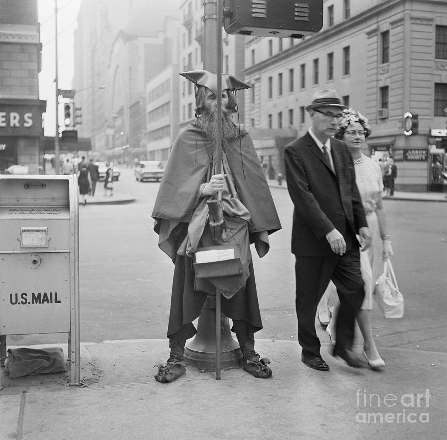 Street Musician Wrapped In Blanket Photograph by Bettmann
