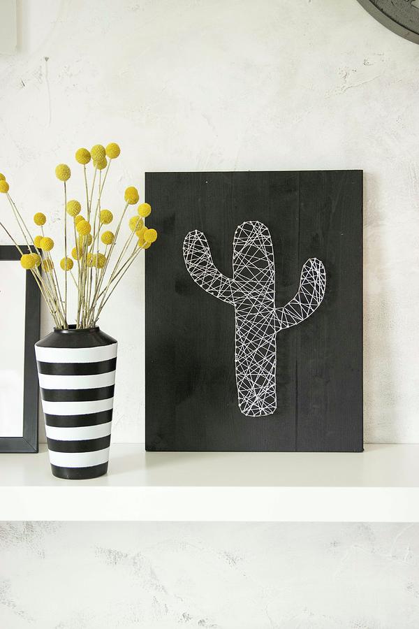 String Art Picture Of Cactus And Black And White Stripes Vase Of Dried Flowers Photograph by Astrid Algermissen