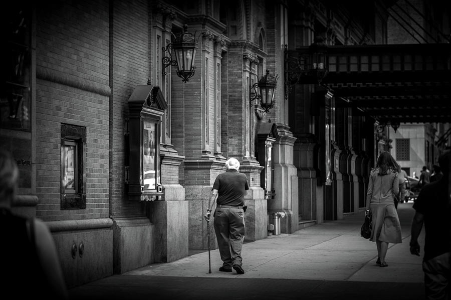 Strolling Past Carnegie Hall In Black and White Photograph by Greg and Chrystal Mimbs