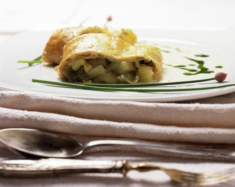 Strudel Di Adamello cheese And Vegetable Strudel, Italy Photograph by Blueberrystudio