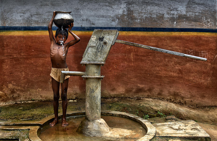 Street Photograph - Struggle For Water by Avishek Das